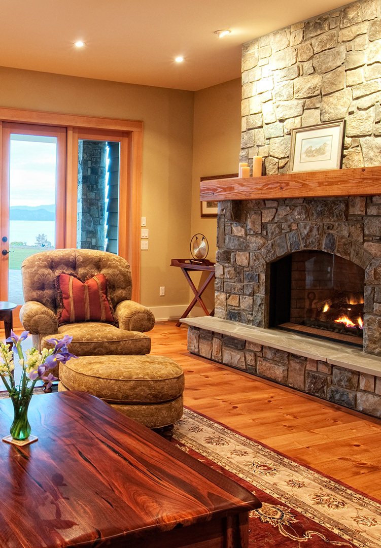 Living room with a stone fireplace